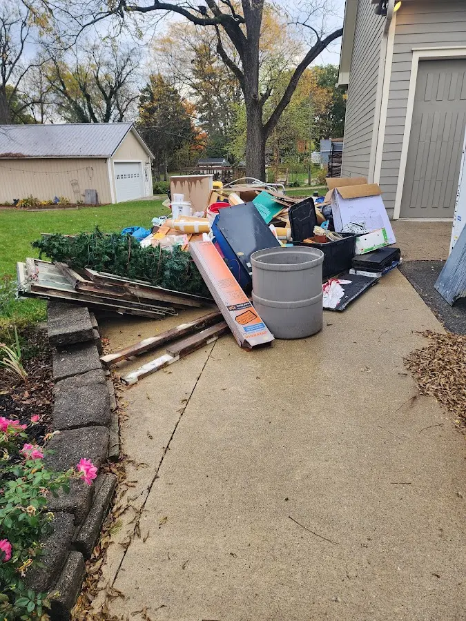 Dumpster being loaded with debris for Residential Dumpster Rental in Forest City